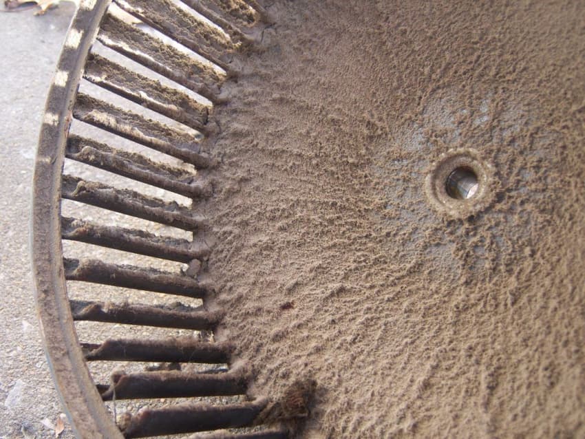 Furnace's blower wheel covered by layer of dust