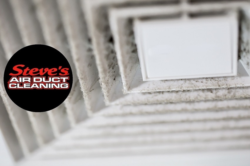 Close-up of dusty air vent with Steve's Air Duct Cleaning logo