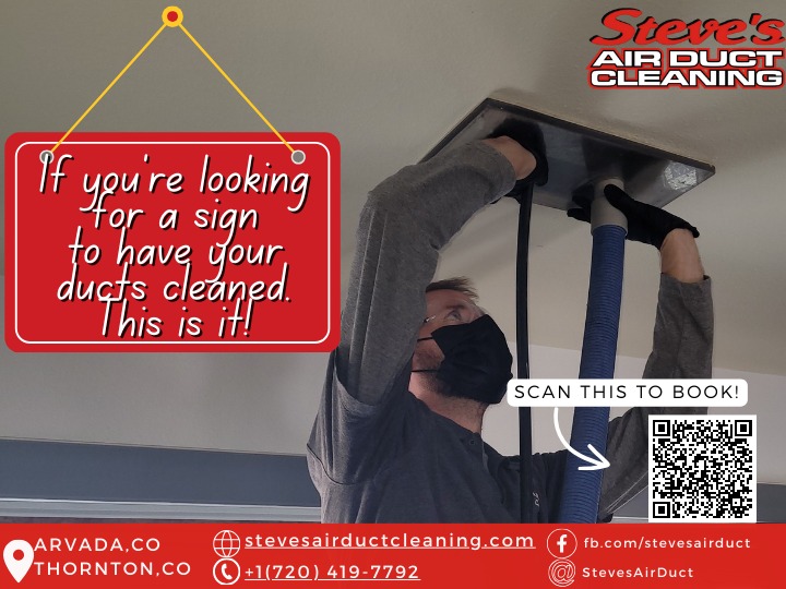 Technician inspecting and cleaning air ducts